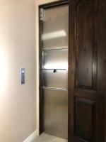 Stainless Steel Panels above and below Dumbwaiter